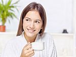 Woman In Bathrobe Relaxing At Home Stock Photo