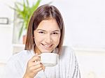 Woman In Bathrobe Relaxing At Home Stock Photo