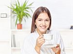 Woman In Bathrobe Relaxing At Home Stock Photo