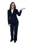 Woman In Business Attire Posing With An Open Palm Stock Photo