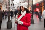 Woman In Red Coat And Wool Cap And Gloves With Smartphone In Han Stock Photo