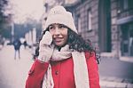 Woman In Red Coat And Wool Cap And Gloves With Smartphone In Han Stock Photo