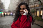 Woman In Red Coat With Mobile Phone In Hands, Smartphone, Urban Stock Photo