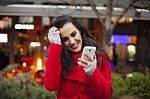 Woman In Red Coat With Mobile Phone In Hands, Smartphone, Urban Stock Photo