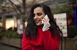 Woman In Red Coat With Mobile Phone In Hands, Smartphone, Urban Stock Photo