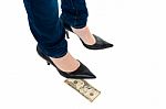 Woman In Stilettos Standing Over Ten Dollar Note Stock Photo