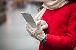 Woman In Wool Gloves Hold Smart-phone Stock Photo