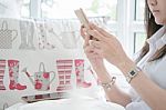 Woman Is Making On-line Purchase Via Cell Phone In Balcony Stock Photo