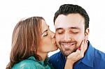 Woman Kissing Her Boyfriend Stock Photo