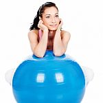 Woman Leaning On The Big Ball Stock Photo