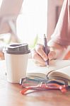 Woman Making Some Important Notes Stock Photo