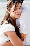 Woman On Her Husband Shoulder Stock Photo