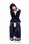 Woman On Suitcase Stock Photo