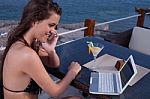 Woman On The Phone With Lap Top  Computer Stock Photo