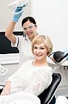 Woman Patient Sitting At Stomatology Clinic Stock Photo