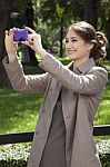 Woman Photographing With Mobile Stock Photo