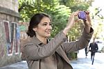 Woman Photographing With Mobile Phone Stock Photo