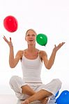 Woman Playing With Balloons Stock Photo