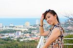 Woman Poses On A High Point Overlooking The City Stock Photo