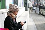 Woman Reading Sms In Cell Phone Stock Photo