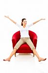 Woman Sat On Armchair Stock Photo