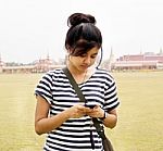 Woman Sending / Receiving A Text Message / Email On Her Mobile / Stock Photo