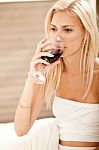 Woman Sipping Wine Stock Photo