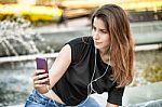 Woman Sitting  And Making Selfie Stock Photo