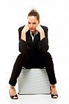 Woman Sitting On Briefcase Stock Photo