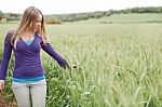 Woman Standing Beside The Field Stock Photo