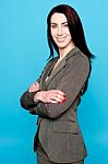 Woman Standing With Crossed Arms Stock Photo