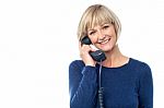 Woman Talking On The Landline Phone Stock Photo