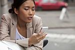 Woman Texting On The Phone Stock Photo