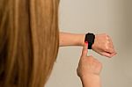 Woman Touching The Apple Watch Stock Photo