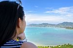 Woman Tourist Watching The Ocean In Phuket, Thailand Stock Photo