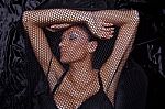 Woman Traped In Black Fishnet Stock Photo