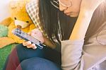 Woman Typing Text Message On Smart Phone In A Cafe Stock Photo