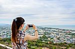 Woman Using Phone Taking Pictures Stock Photo