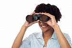 Woman Watching Through Binoculars Stock Photo