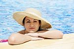 Woman Wearing Hat In Pool Stock Photo