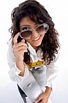 Woman Winking Behind Eyeglasses Stock Photo