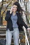 Woman With Cell Phone Walking Stock Photo