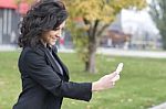 Woman With Cell Phone Walking Stock Photo