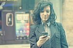 Woman With Cell Phone Walking Stock Photo