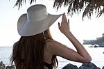 Woman With Hat Looking At Sea Stock Photo