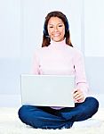 Woman With Headphones And Laptop Stock Photo