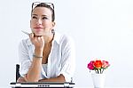 Woman With Laptop Working At Home Stock Photo