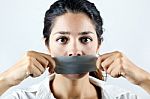 Woman With Mouth Covered With Tape. Concept Of Forbidden Opinion Stock Photo