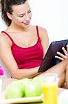 Woman With Tablet At Home Stock Photo