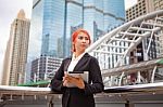 Woman With Tablet At Modern City Stock Photo